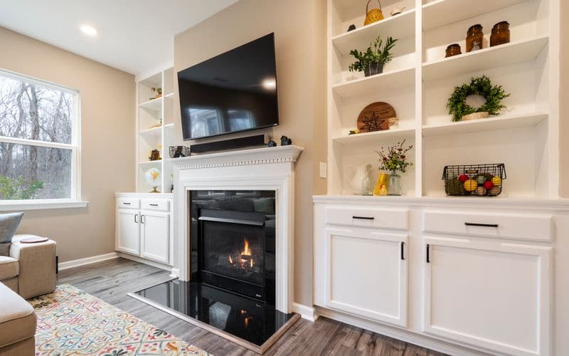 Modern living room with built-in shelving and feature wall